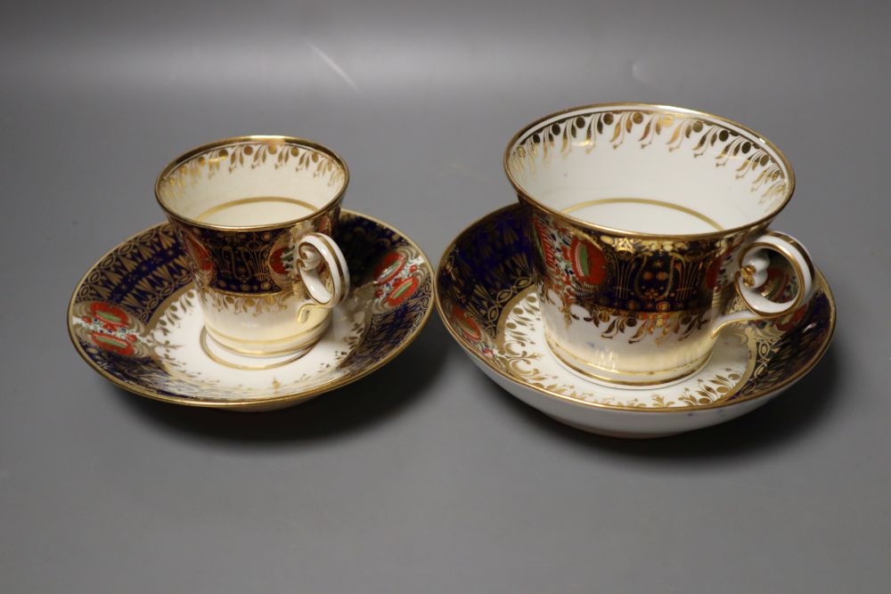 A Chamberlain Worcester cup and saucer in an imari style and a small cup and saucer in the same pattern, 15.5cm